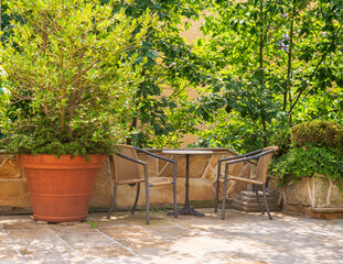 Garden furniture in a lush well maintained and cared garden