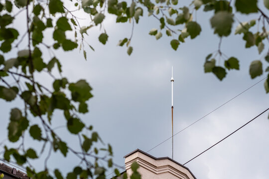 Lightning rod on a roof in a rainy day
