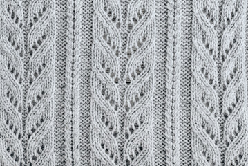 Knit texture of light gray wool knitted fabric