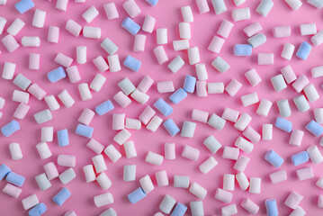 Colorful marshmallows pattern on blue background. - 771491692