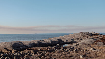 view from the seashore, rocky beach
