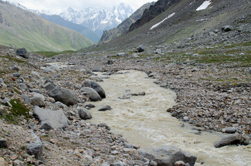 a mountain river flowing down a mountain gorge.a stormy water flow.