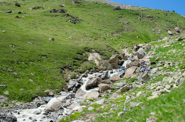 a mountain river flowing down a mountain gorge.a stormy water flow.