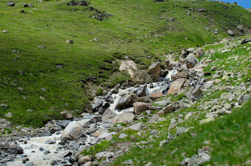 a mountain river flowing down a mountain gorge.a stormy water flow.