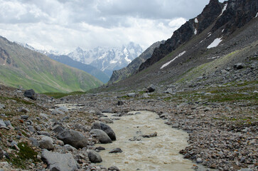a mountain river flowing down a mountain gorge.a stormy water flow.