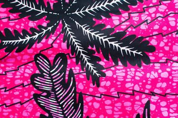 top view of pink ankara fabric, flatlay of nigerian wax cloth with designs, spread out pink ankara...