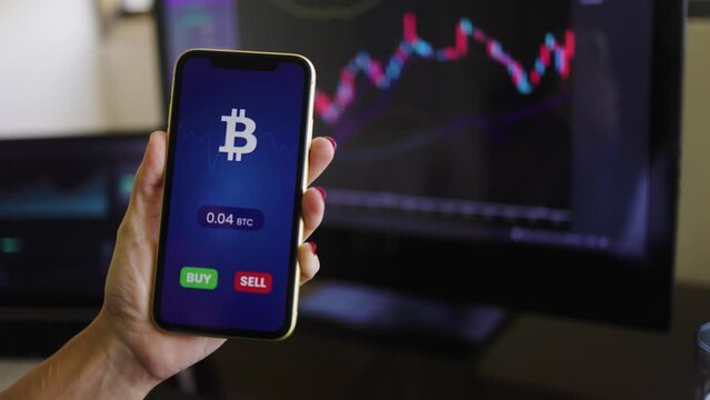 Business trader using crypto payment service app with mobile phone for Bitcoin purchase. Cryptocurrency trend technology concept