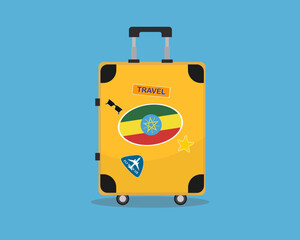 Suitcase or baggage with Ethiopia flag, holiday and vacation idea