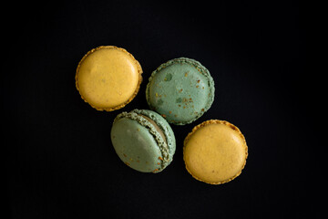 Traditional French sweets - lemon and pistachio macaroons with cream