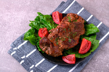 Roasted pork neck served with vegetables. Hot meat meal with spices - 771508011