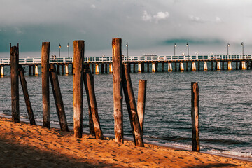 View of the sea or ocean water on an old wooden pier or bridge