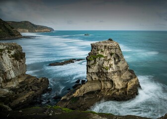 Fototapeta na wymiar Muriwai Rocks, near Auckland, New Zealand during winter.