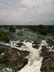 Aerial view of a lush green landscape and the winding Mekong River in Laos