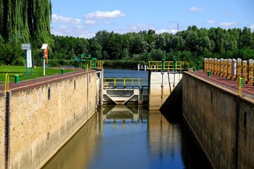 Lock gates of the water dam in river. Dam on river Nogat in Biala Gora (Biała Góra).