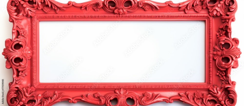Poster a red photograph frame in a rectangular shape is displayed on a white wall. the contrast between the