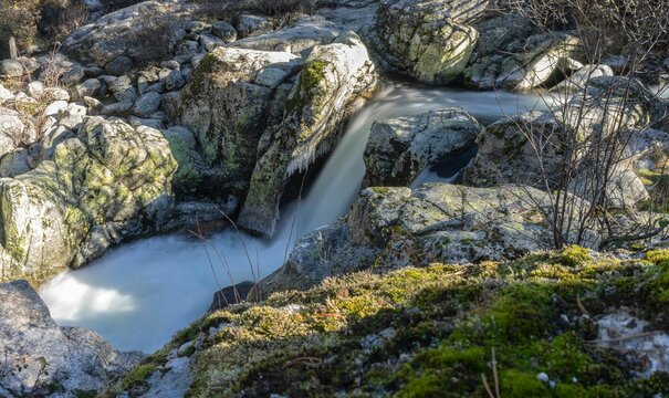 Waterfall cascading down the rocks in Rascafria, Madrid, Spain