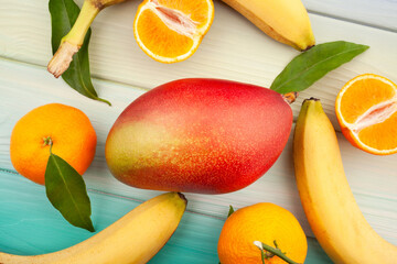 mango fruit on wood background top view