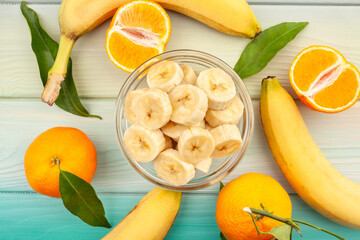 sliced banana bowl on wood background top view - 771525273