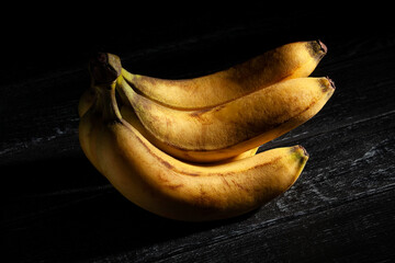 banana bunch on black background - 771525440