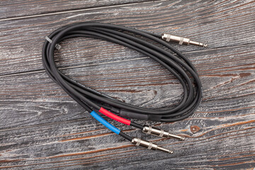 audio insert splitter cable on wood background