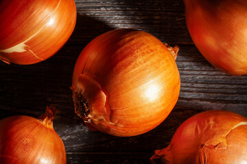 onions on black wood background top view