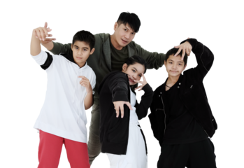 Asian young professional dancer and teacher is posting with students in hip hop and break dancing in dance class