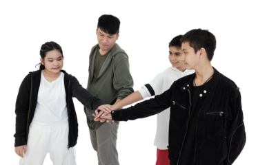 Asian young professional dancer and teacher is posting with students in hip hop and break dancing in dance class