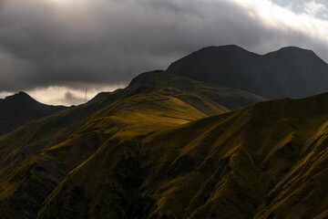 Stunning mountain range with rolling hills and lush green grass carpeting the landscape, Georgia