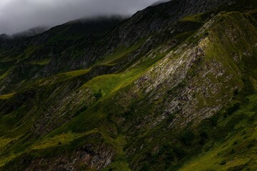 Stunning mountain range with rolling hills and lush green grass carpeting the landscape, Georgia