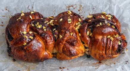 Chocolate Babka before and after baking. Stuffed with chocolate cream. Copy space.