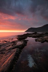 Tranquil evening scene of a rocky shore and sea. Norway, Lofoten.