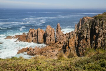 Closeup of blue tranquil water and majestic rocks.Phillip island