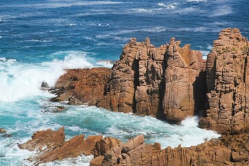 Closeup of blue tranquil water and majestic rocks .Phillip island