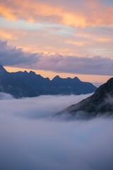 Vertical shot of sunset clouds over the Alps in Switzerland