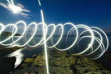 White light making circles of a spiral on the rocks
