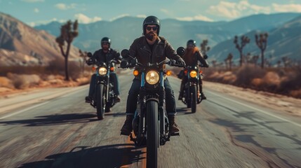 A group of bikers ride together on an empty road. - obrazy, fototapety, plakaty