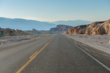 Driving in Death Valley. Death Valley National Park in Inyo County of Mojave Desert, California is the hottest place on earth with a temperature of 56,7 °C recorded in 1913. - 771542255