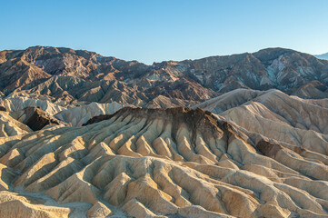 View from Zabriskie Point. Death Valley National Park in Inyo County of Mojave Desert, California is the hottest place on earth with a temperature of 56,7 °C recorded in 1913. - 771542270