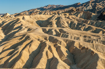 View from Zabriskie Point. Death Valley National Park in Inyo County of Mojave Desert, California is the hottest place on earth with a temperature of 56,7 °C recorded in 1913. - 771542287