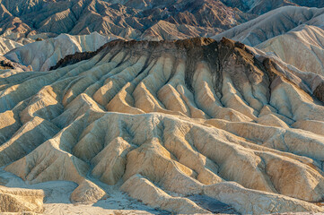 View from Zabriskie Point. Death Valley National Park in Inyo County of Mojave Desert, California is the hottest place on earth with a temperature of 56,7 °C recorded in 1913. - 771542294