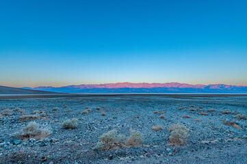 Dawn at Badwater Basin in Death Valley, the lowest point in US at 86 meter below sea level. Death Valley National Park, CA is the hottest place on earth with a temperature of 56,7 °C recorded in 1913. - 771542493