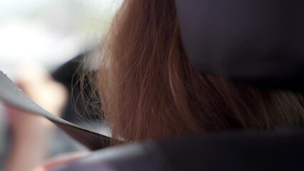 Close up seat belt over the woman shoulder during the car driving. International traffic laws and safe driving rules and tips.
