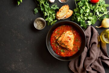 Baked chicken with tomato gravy and herbs