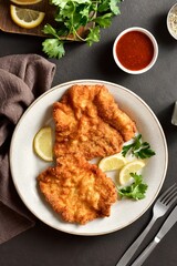 Schnitzel with lemon and leaves of parsley