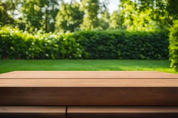 Wooden tabletop for montage or product display against a blurred lawn green backdrop.