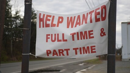 Help Wanted sign hanging by side of a rural West Virginia road in autumn. - Powered by Adobe