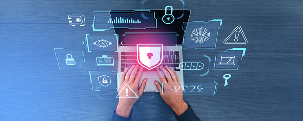 Man using laptop, digital cybersecurity chart with big business data