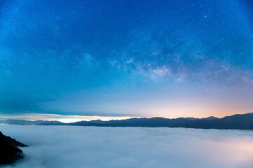 Capture the mesmerizing dance of the Milky Way, dynamic cloud formations, and vibrant neon lights...