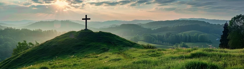 Foto op Plexiglas The verdant hill is illuminated by the first light of dawn, revealing a Christian cross. © Lucky_jl