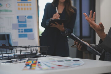 Close up ux developer and ui designer use augmented reality brainstorming about mobile app interface wireframe design on desk at modern office.Creative digital development agency